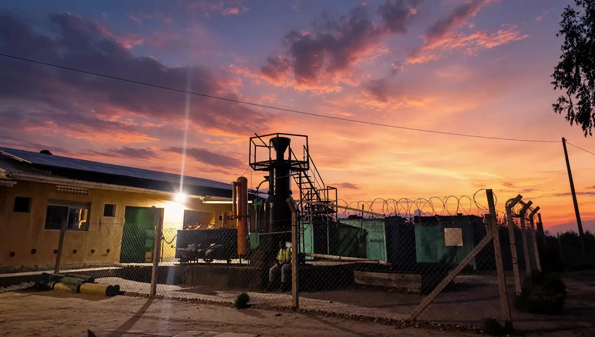 The gasifier and control building at Got Ngur under a sunset sky