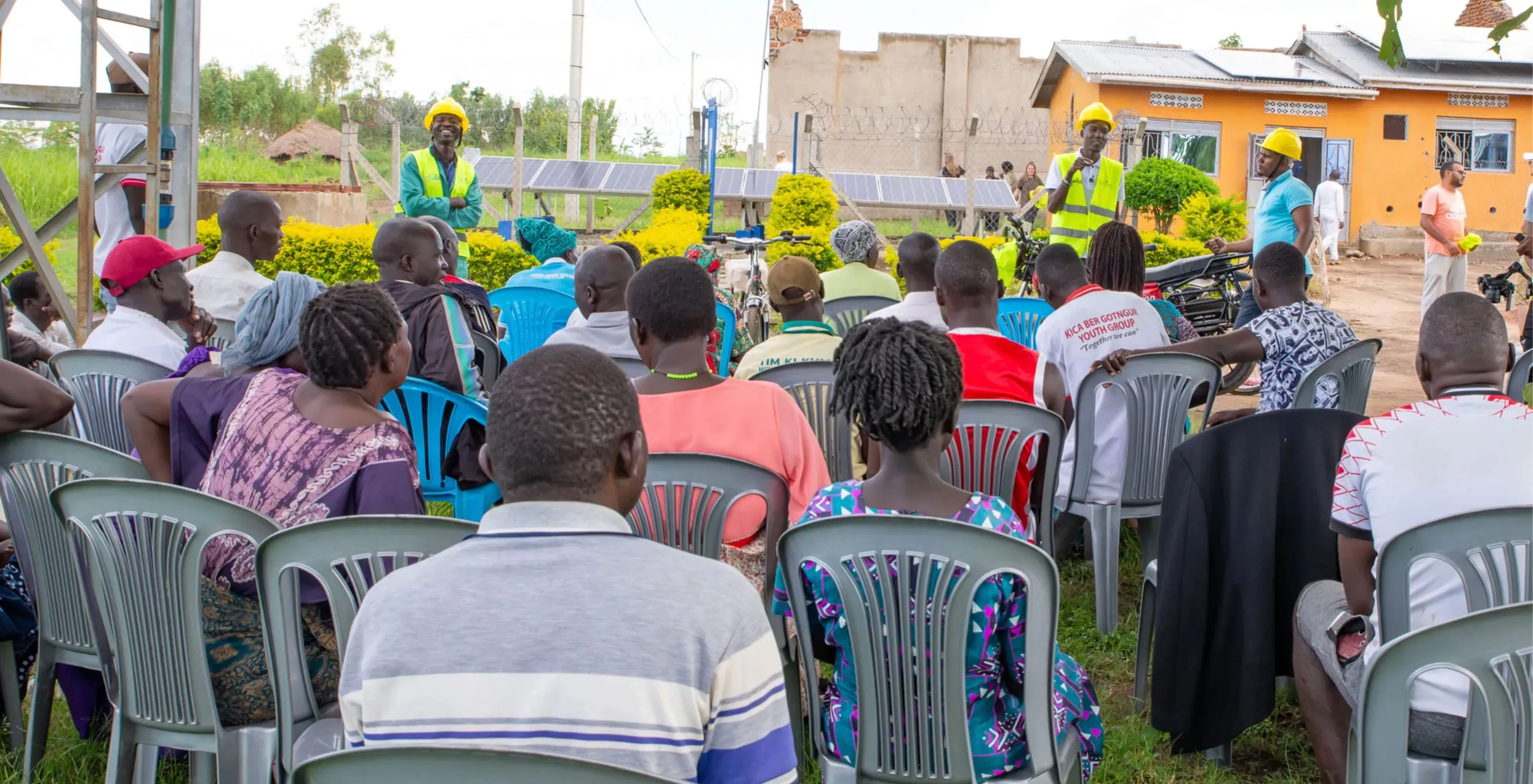 A seated community meeting at Got Ngur, addressed by Mandulis Energy staff