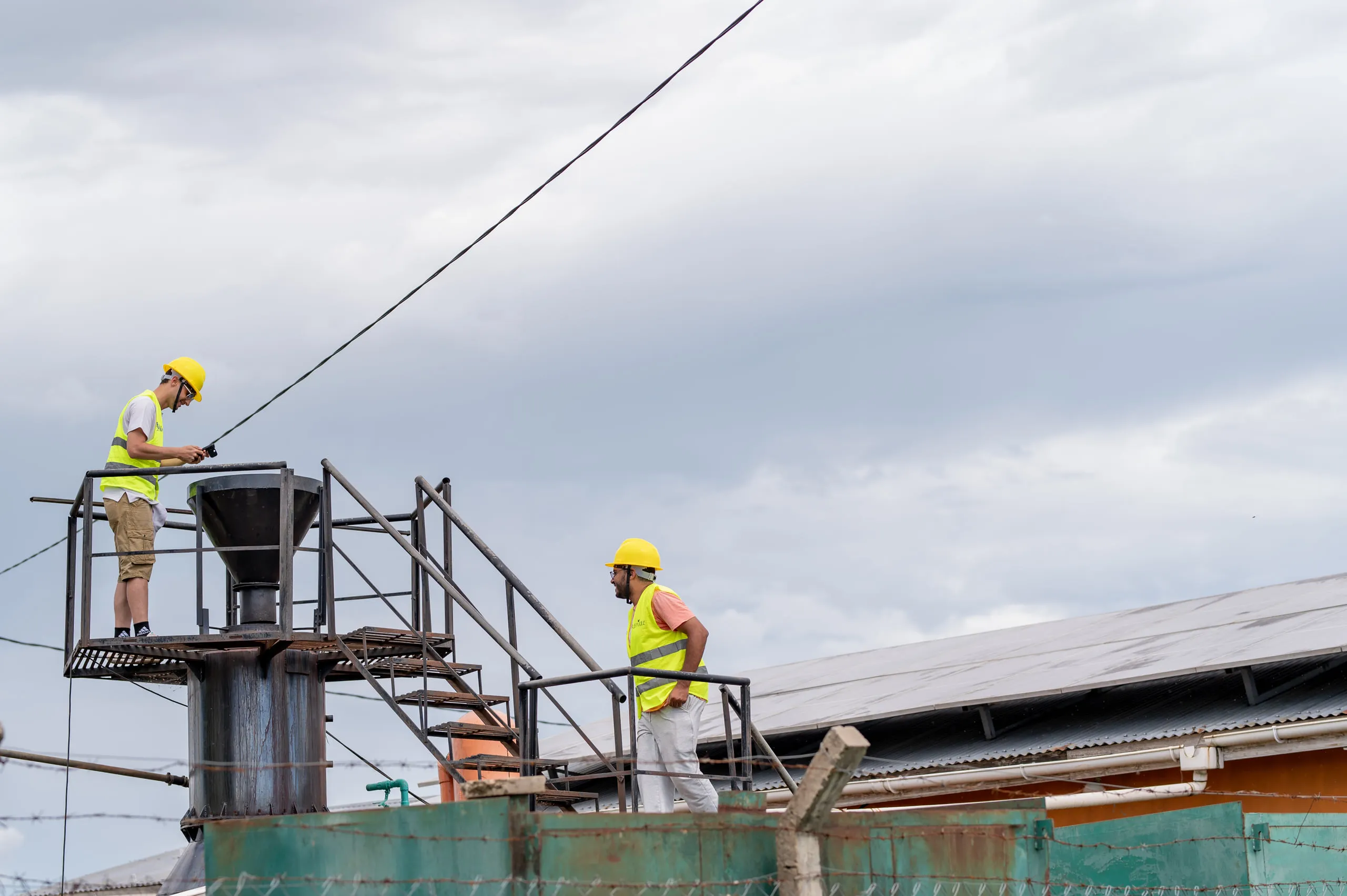 Mandulis Energy workers on the plant structure at Got Ngur