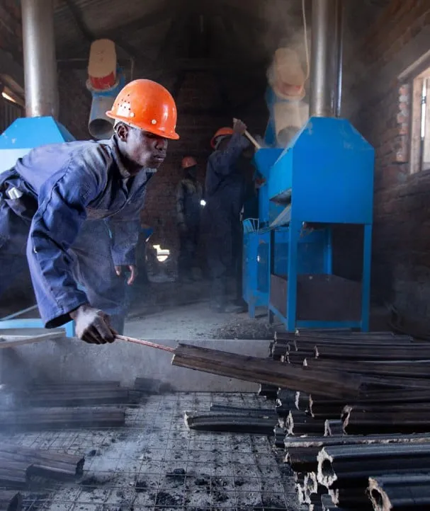 A worker at the pellet production line