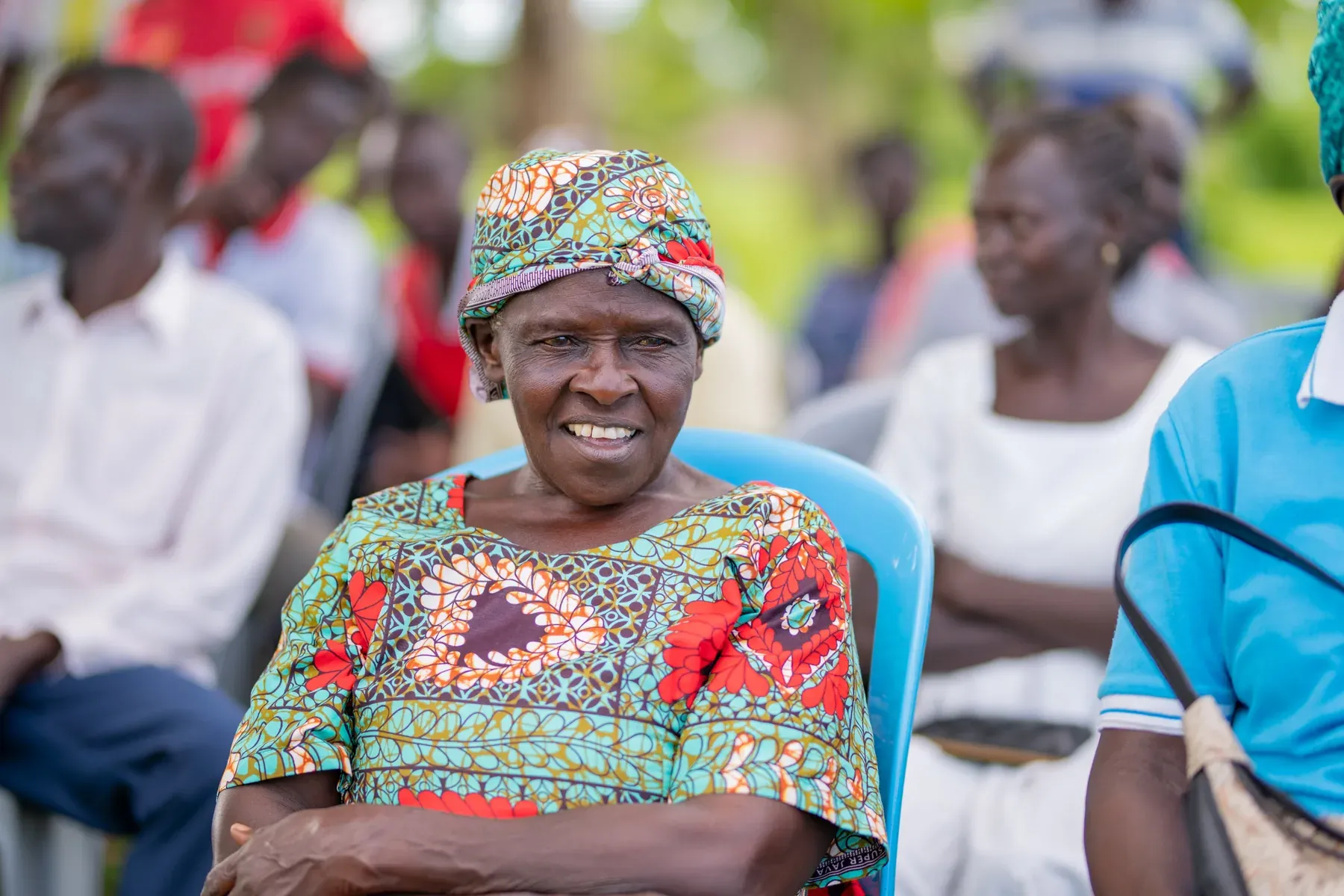 A member of the Got Ngur community seated at a project meeting