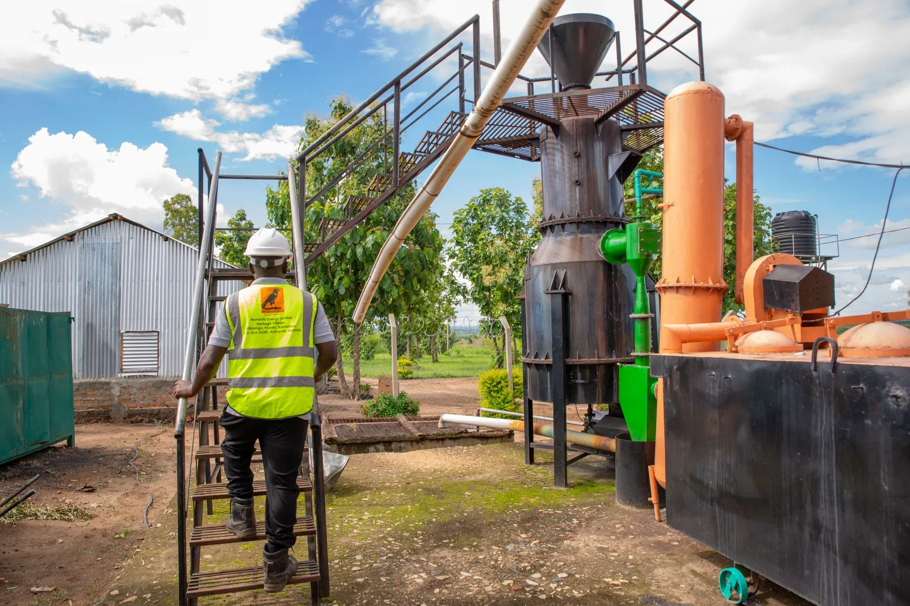 A worker climbing the access ladder to the gasifier at Got Ngur